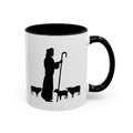 Front of the White Mug with Black Interior on White Backdrop: "White ceramic mug with black interior, highlighting a simple black ink design of Jesus and sheep on the front. Photographed against a white backdrop, this accent mug comes in 11oz and 15oz sizes, perfect for adding spiritual inspiration to your coffee routine.
