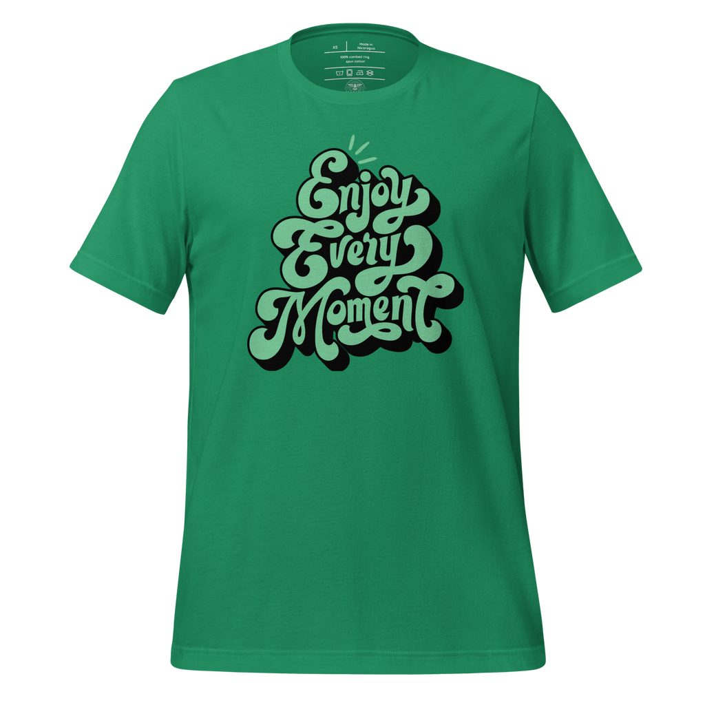 Close-up of 'Enjoy Every Moment' graffiti script on a green T-shirt, highlighting the bold and inspiring lettering on this soft and durable fabric.