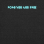 Close-up of the 'Forgiven and Free' text in vibrant neon blue on Heavenly Crafted's Black Heather T-shirt, highlighting the inspirational design and high-quality printing.