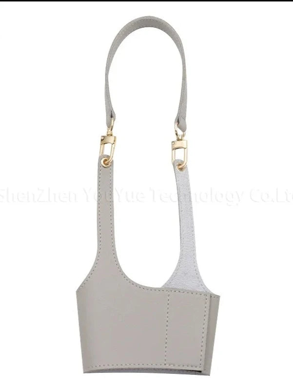 Cream Leather: "Cream Leather Cup Sleeve, combining insulation and style for coffee and tea cups. Made from high-quality PU leather, providing a soft and neutral tone with a secure grip for any cup.