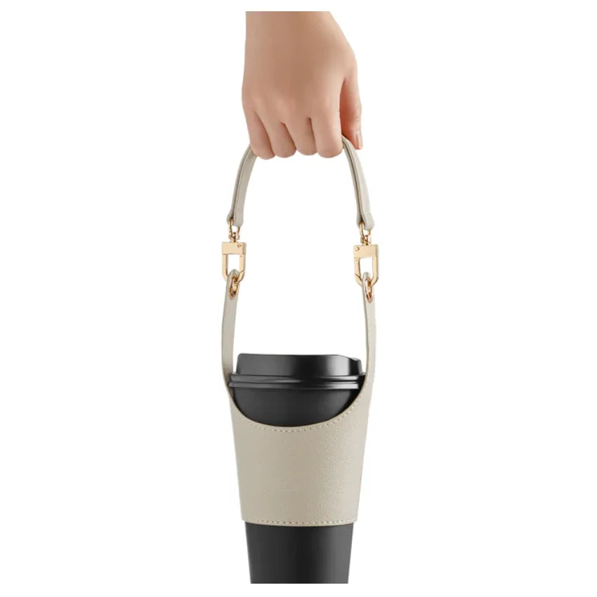 Mockup with Cream Product with a Coffee Mug in It: "Cream Leather Cup Sleeve wrapped around a coffee mug, showcasing its insulating properties and snug fit. Made from premium PU leather for a stylish and practical addition to your coffee routine.