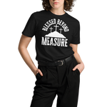 "Female model wearing the 'Blessed Beyond Measure' T-shirt in black, stylishly tucked into her outfit. The bold white lettering stands out, showing the versatile and faith-inspired design by Heavenly Crafted, perfect for a chic and spiritual look.
