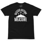 'Blessed Beyond Measure' T-shirt laid out flat with a slightly wrinkled, relaxed look. Displaying the bold white lettering on the black fabric, showcasing the casual and comfortable style of this Heavenly Crafted faith-inspired apparel.