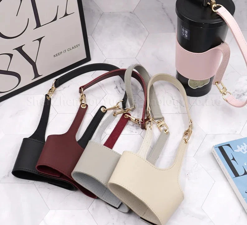 Alt Text of the Full Set: "Full set of Leather Cup Sleeves in black, burgundy brown, white, cream, and pink, arranged around a coffee mug. Each sleeve offers insulation and a non-slip grip, crafted from high-quality PU leather for a vibrant and stylish look.