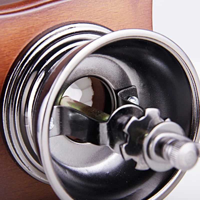 Classic Manual Coffee Grinder - Single Mockup: "Classic Wooden Manual Coffee Grinder in a natural wood finish, featuring a vintage design and durable stainless steel components. Ideal for a refined coffee-making experience.