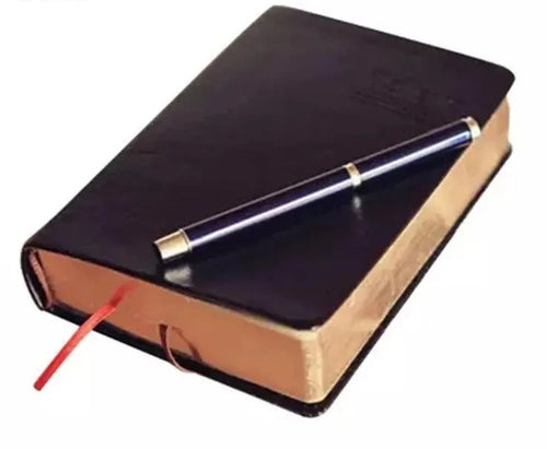 Closed Blank Book with Bible look and a pen resting on top, featuring an elegant PU leather cover. Perfect for personal reflections, journaling, and capturing thoughts and prayers.