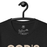 Heavenly Crafted's 'God's Work in Progress' T-shirt in Charcoal Black hanging on a wooden hanger, featuring a simple and bold text design. Perfect for expressing faith and embracing growth.