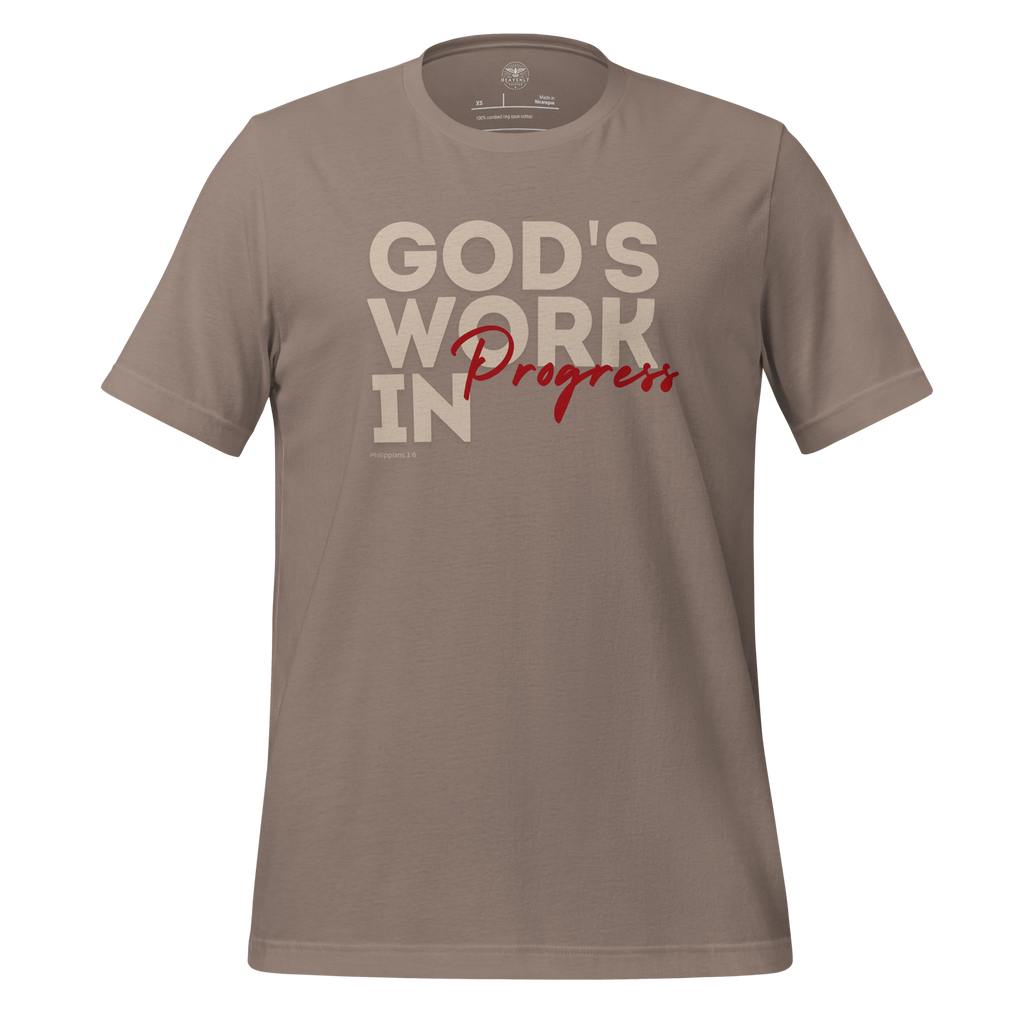 3D relaxed mockup of Heavenly Crafted's 'God's Work in Progress' T-shirt in Tan, featuring an elegant and bold text design inspired by Philippians 1:6. A faith-inspired tee for continuous spiritual growth