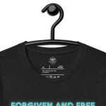 Inside label of Heavenly Crafted's 'Forgiven and Free' T-shirt, detailing fabric composition and care instructions. Made with premium quality for a comfortable and durable wear.