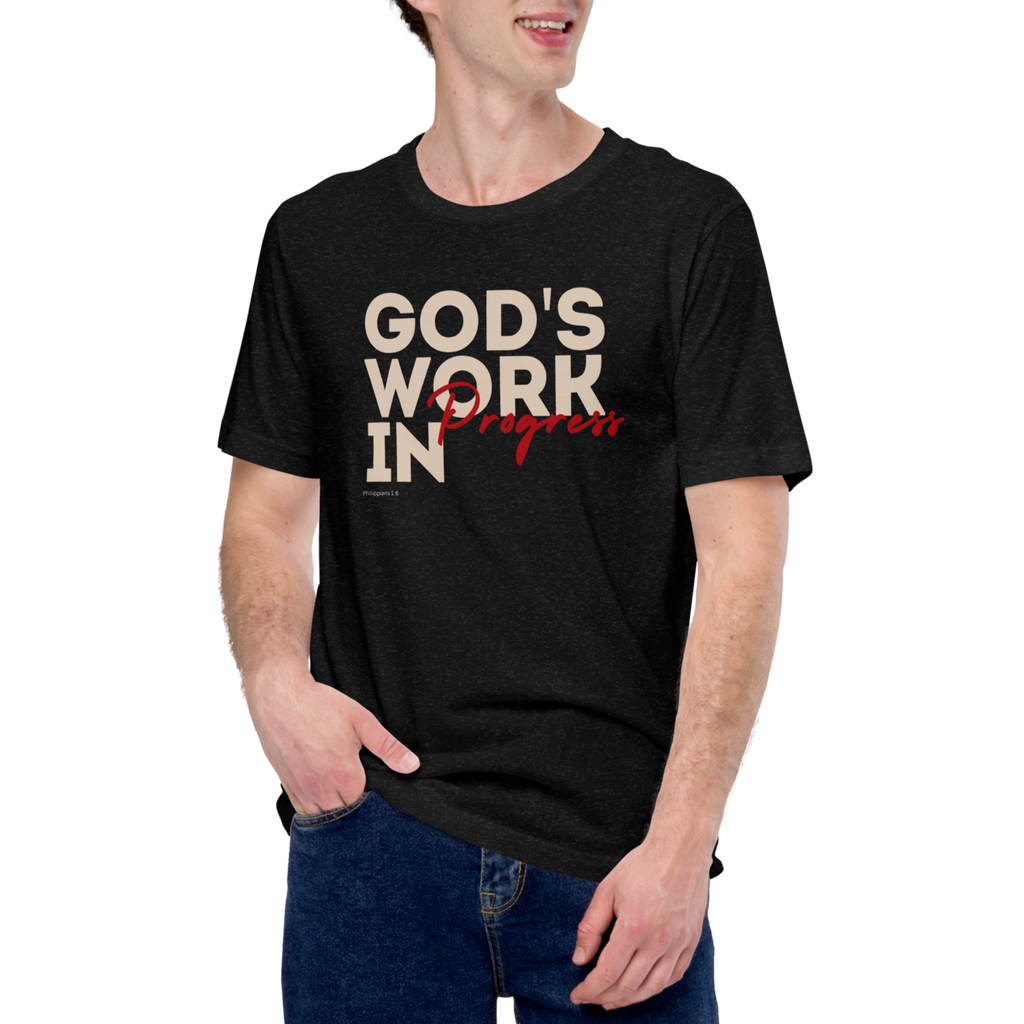 Male model wearing Heavenly Crafted's 'God's Work in Progress' T-shirt in Tan, offering a comfortable and stylish look that embraces the message of faith and personal growth.