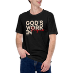 Male model wearing Heavenly Crafted's 'God's Work in Progress' T-shirt in Tan, offering a comfortable and stylish look that embraces the message of faith and personal growth.