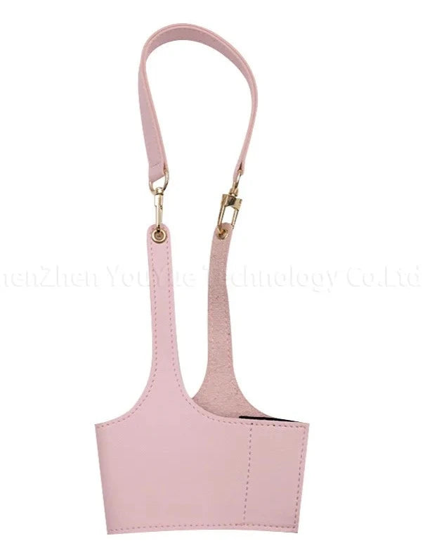 Pink Product: "Pink Leather Cup Sleeve, designed to insulate and protect coffee and tea cups. Made from high-quality PU leather for a stylish and functional grip, perfect for adding a pop of color to your drink.