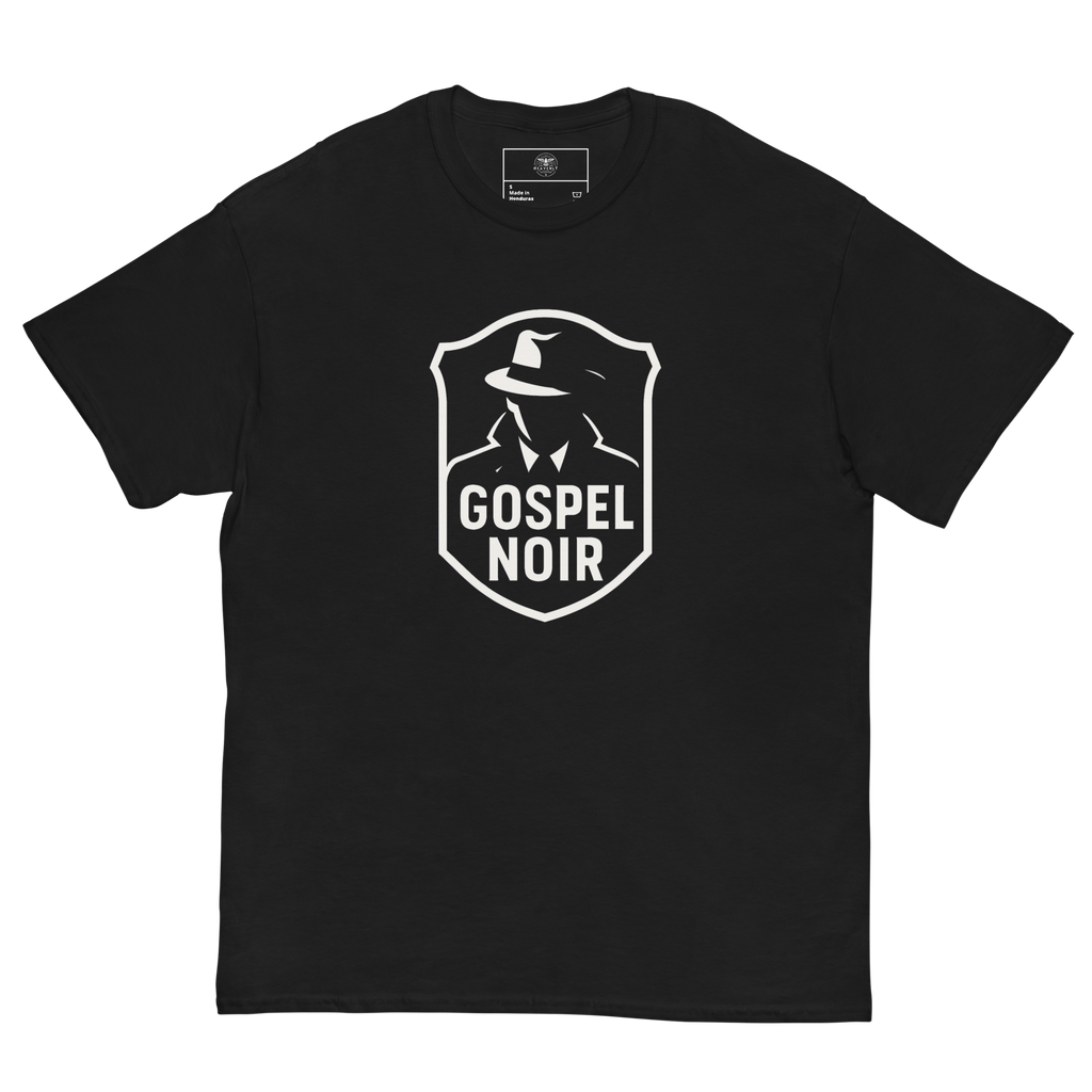 Flat lay Gospel Noir black cotton tee – front facing logo, Heavenly Crafted