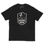Flat lay Gospel Noir black cotton tee – front facing logo, Heavenly Crafted