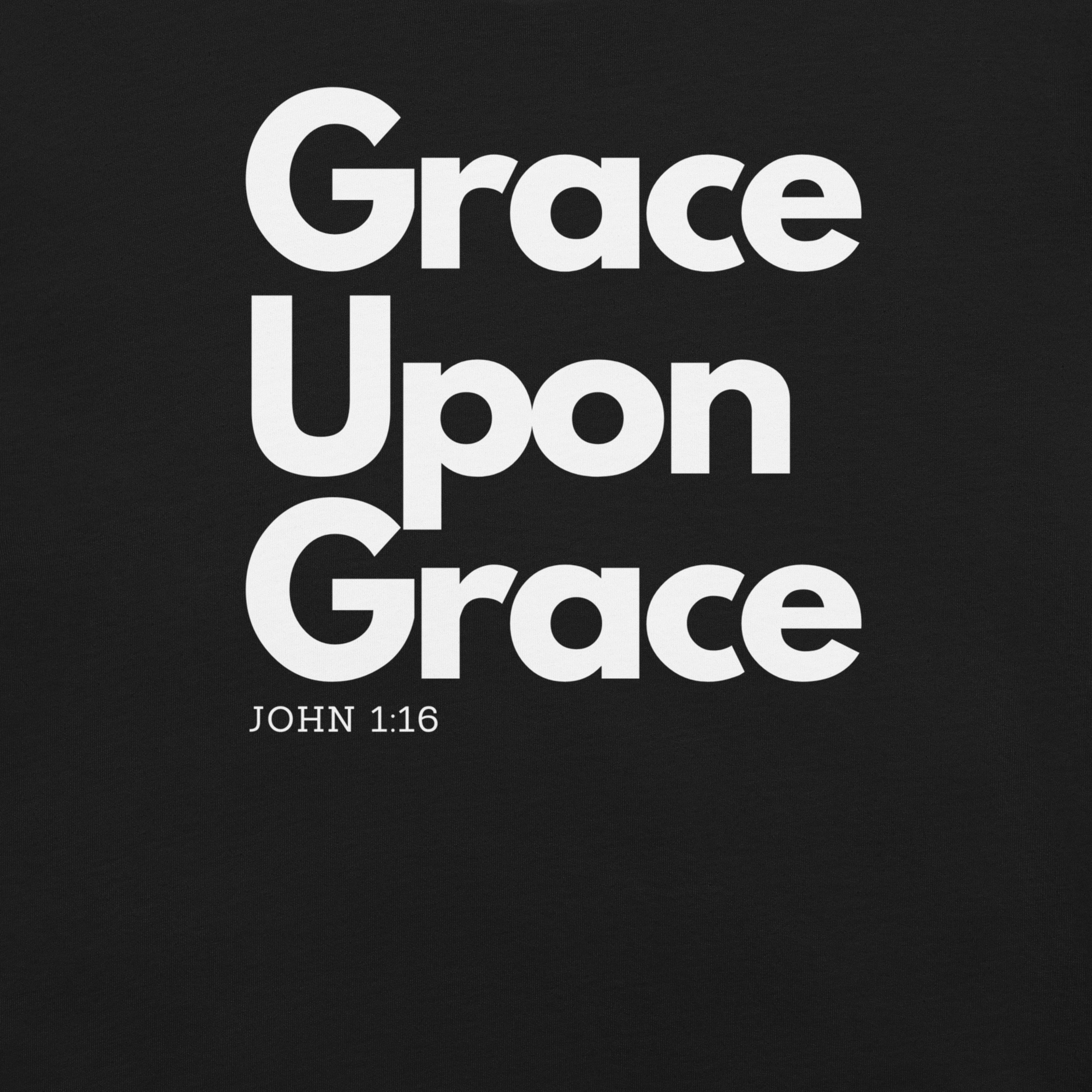Close-up of 'Grace Upon Grace' white text on black T-shirt.