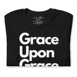 Folded black T-shirt with 'Grace Upon Grace' in white text.