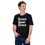 Model wearing 'Grace Upon Grace' T-shirt, three-quarter view.