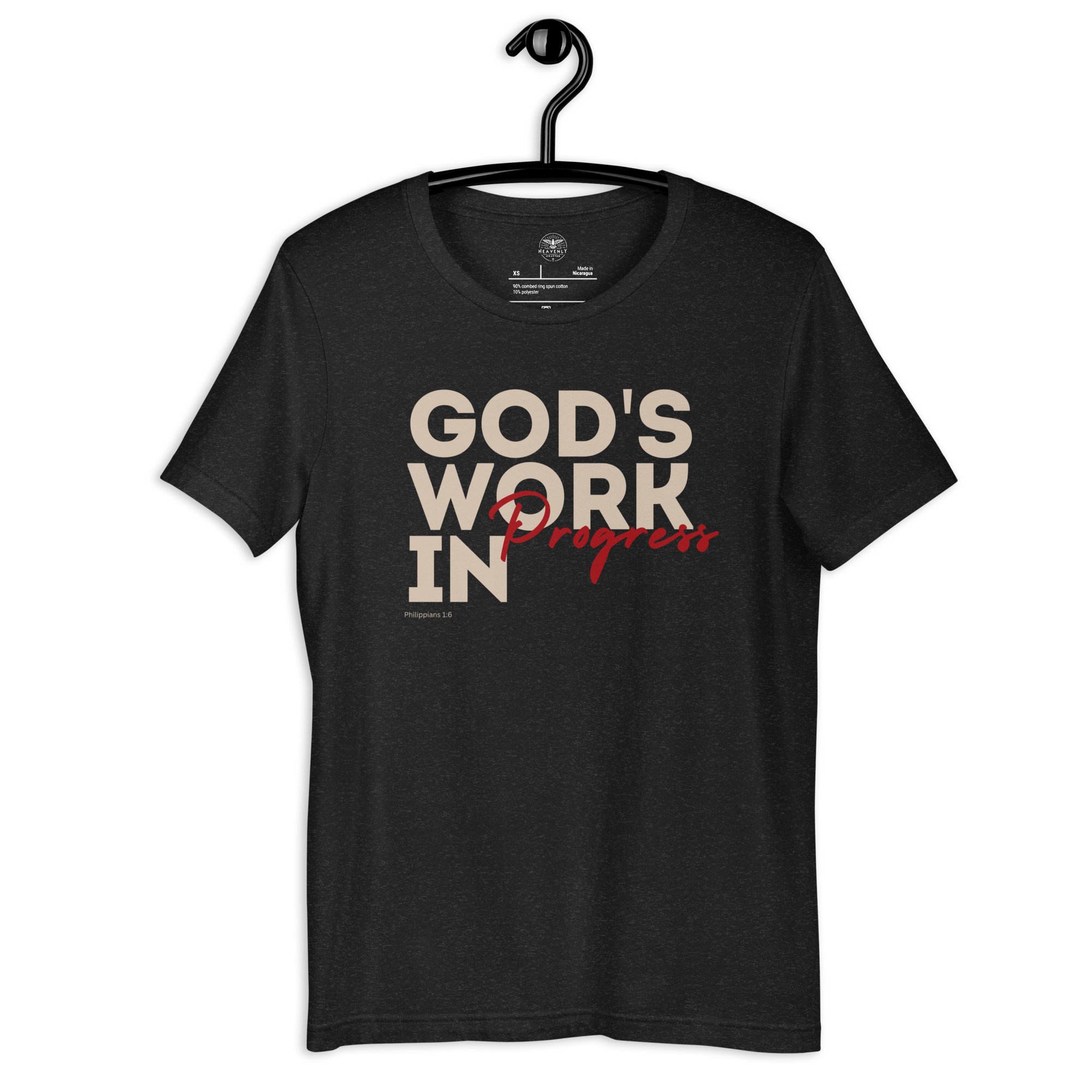 Charcoal Black 'God's Work in Progress' T-shirt hanging on a wooden hanger.