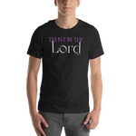 Model wearing 'Trust in the Lord' T-shirt in Black Heather Front view. Male