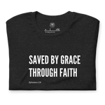 Folded Black Heather T-shirt with 'Saved by Grace Through Faith' in white bold script.