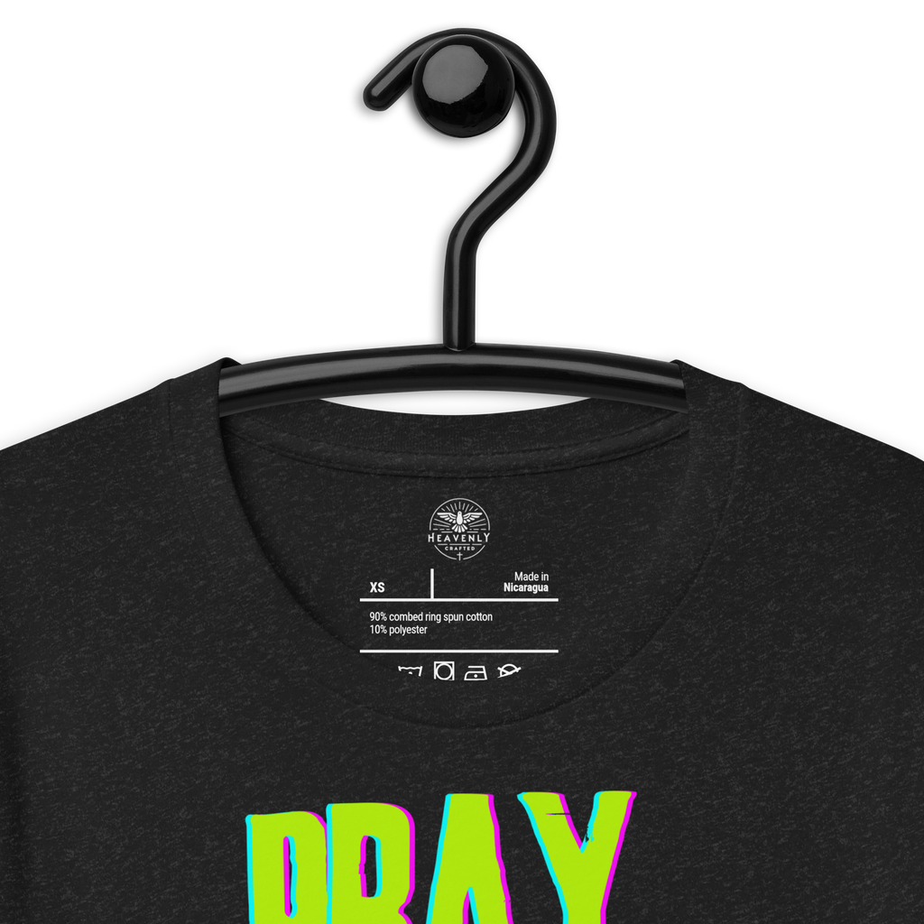Black Heather 'Pray More Worry Less' T-shirt on a wooden hanger showcasing front design.. Brand label inside 'Pray More Worry Less' T-shirt showing fabric and care details.