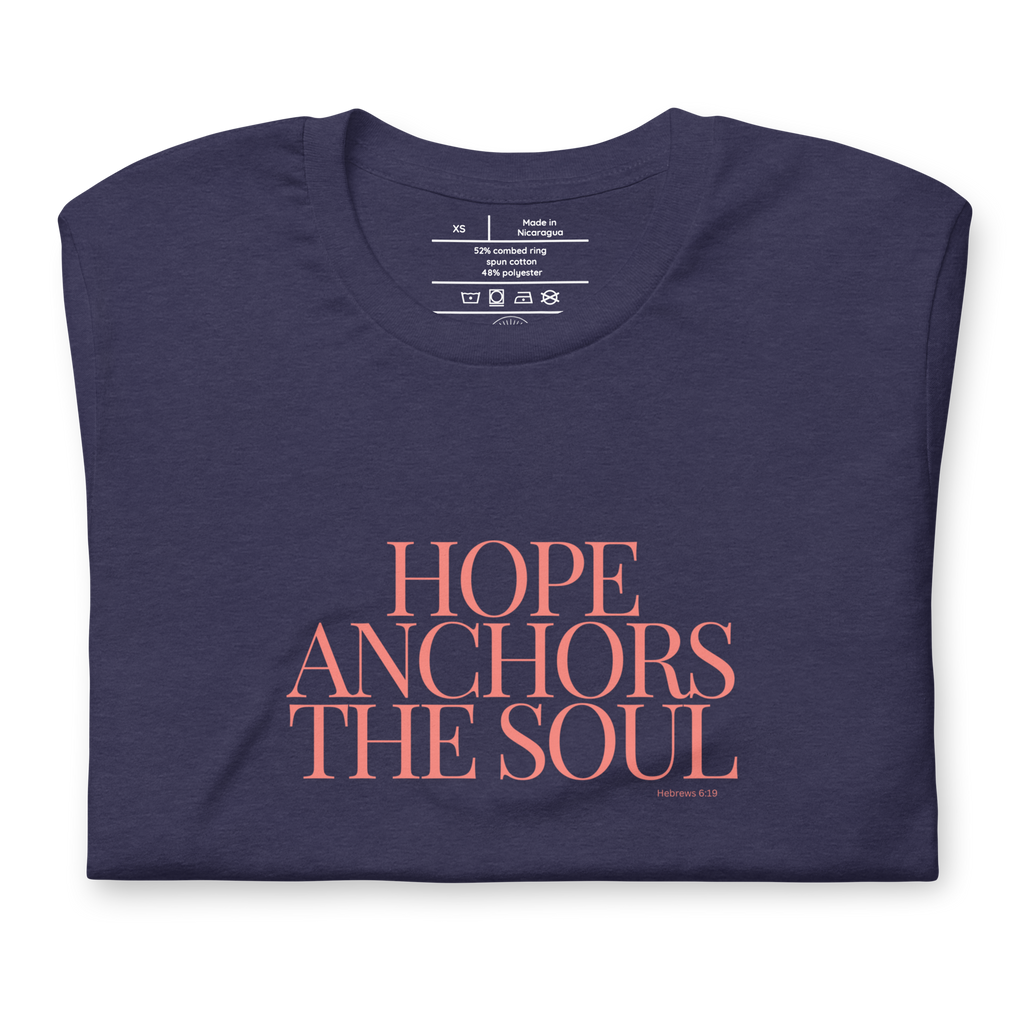 Folded Heather Midnight Navy T-shirt with 'Hope Anchors the Soul' in pink text.