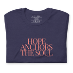 Folded Heather Midnight Navy T-shirt with 'Hope Anchors the Soul' in pink text.