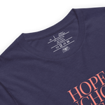 "Inside label of 'Hope Anchors the Soul' T-shirt, showing care instructions and fabric details.