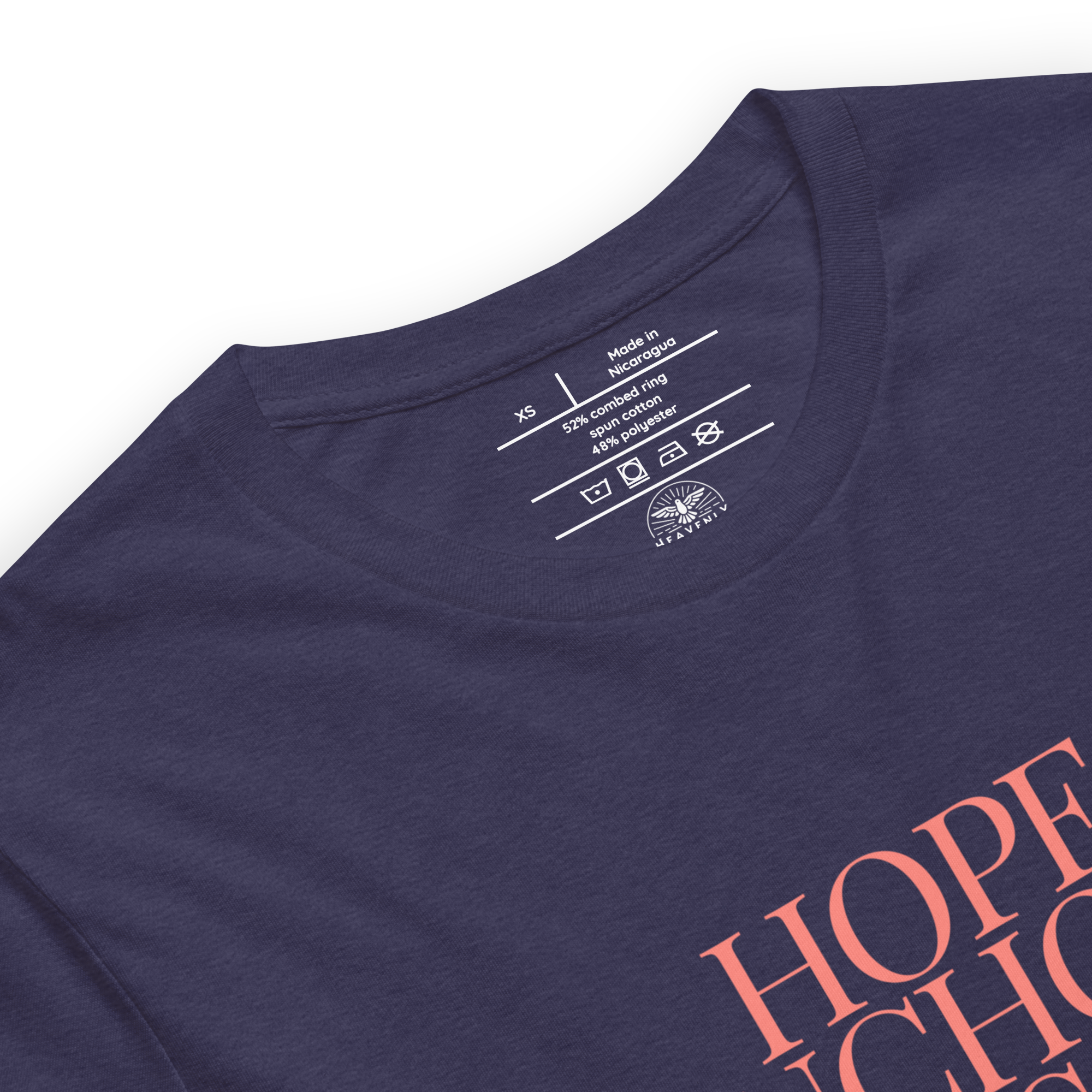 "Inside label of 'Hope Anchors the Soul' T-shirt, showing care instructions and fabric details.
