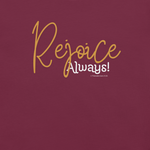 Close-up of 'Rejoice Always' text in white on black T-shirt.