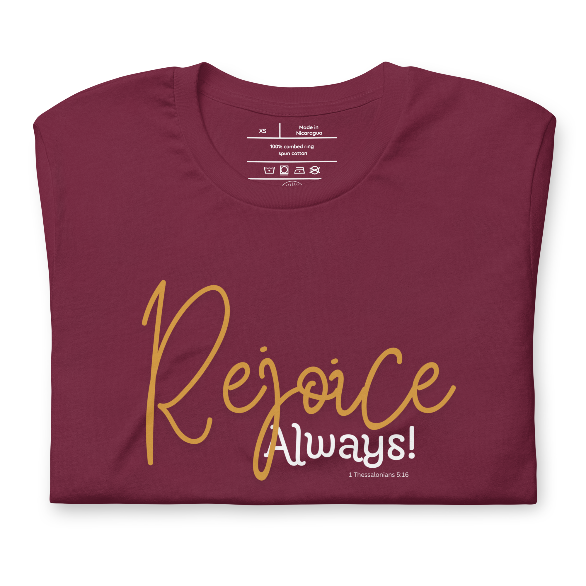 Folded black T-shirt with 'Rejoice Always' in white script.