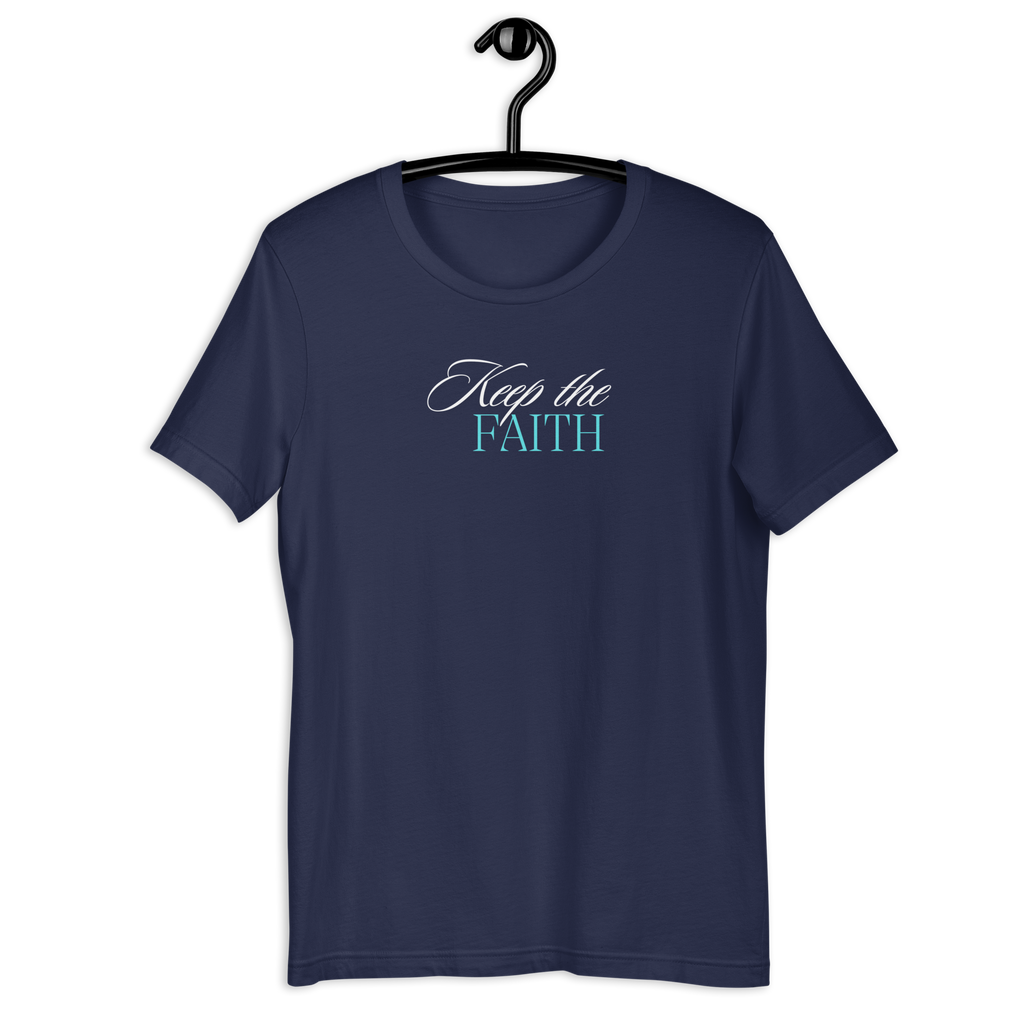 Front view of 'Keep the Faith' T-shirt hanging on a wooden hanger.