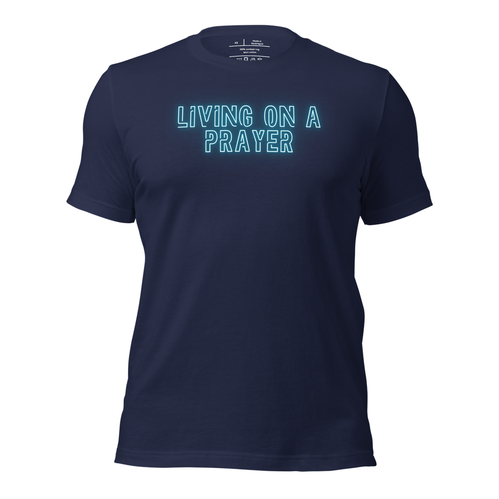 3D mockup of 'Living on a Prayer' T-shirt, featuring neon text on navy fabric.