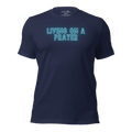 3D mockup of 'Living on a Prayer' T-shirt, featuring neon text on navy fabric.