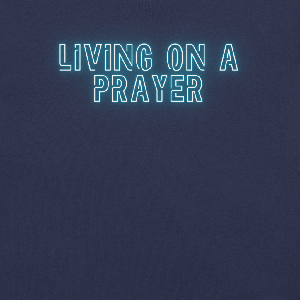 Close-up of neon 'Living on a Prayer' text on navy T-shirt, glowing effect.