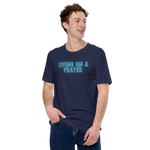 Model wearing 'Living on a Prayer' neon glow T-shirt, three-quarter view, showcasing vibrant design.