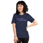 Three-quarter view of a model wearing the navy 'More of Him, Less of Me' T-shirt.