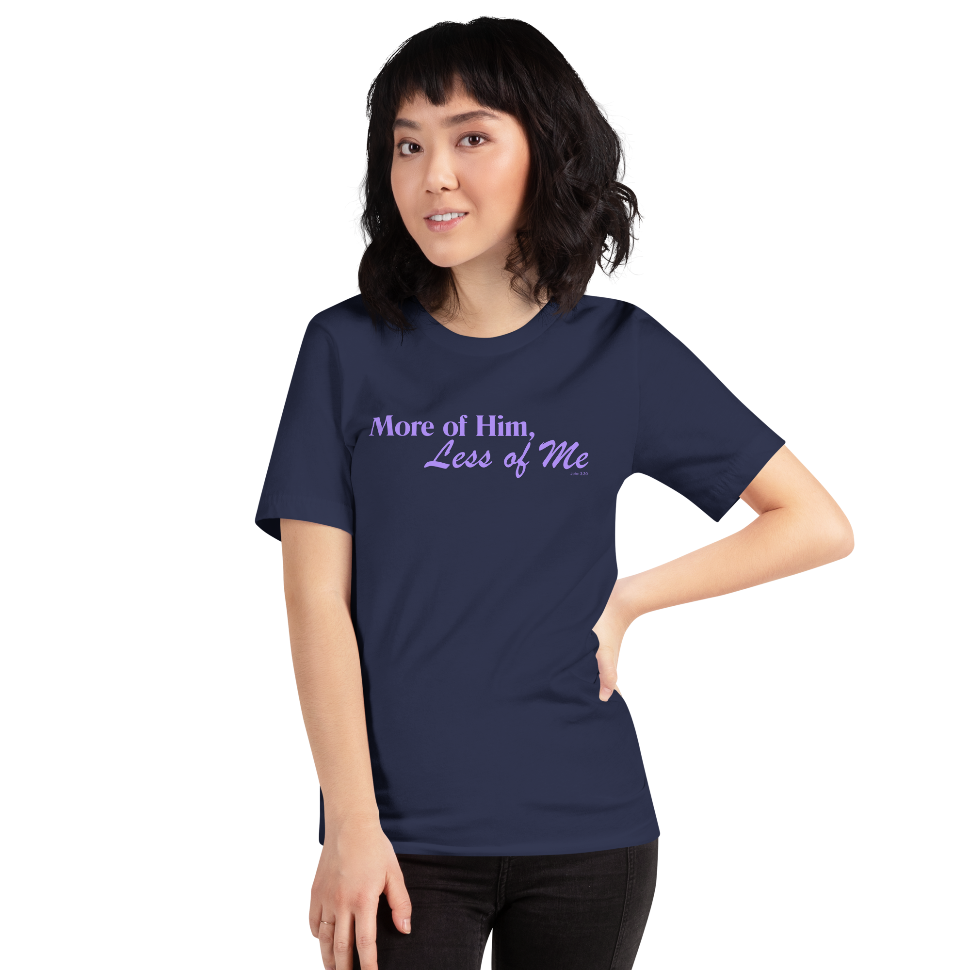 Three-quarter view of a model wearing the navy 'More of Him, Less of Me' T-shirt.