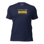 3D mockup of 'Let Your Light Shine' T-shirt, navy with glowing yellow text.