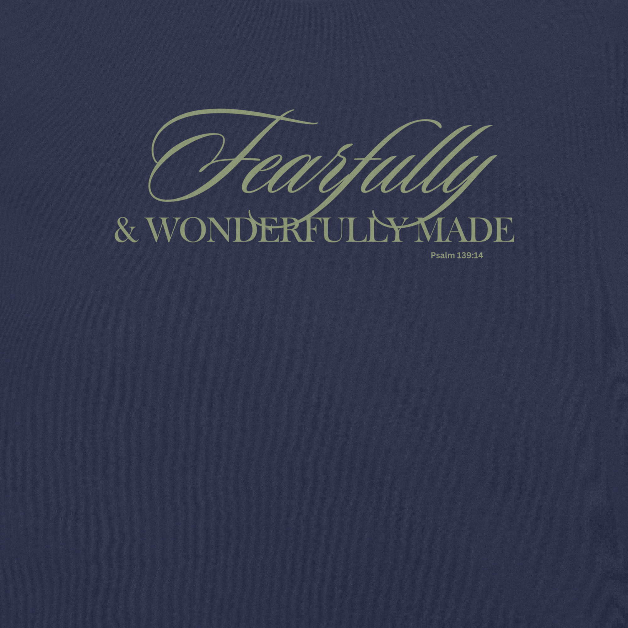 Close-up of 'Wonderfully Made' text in gold on the Navy T-shirt.
