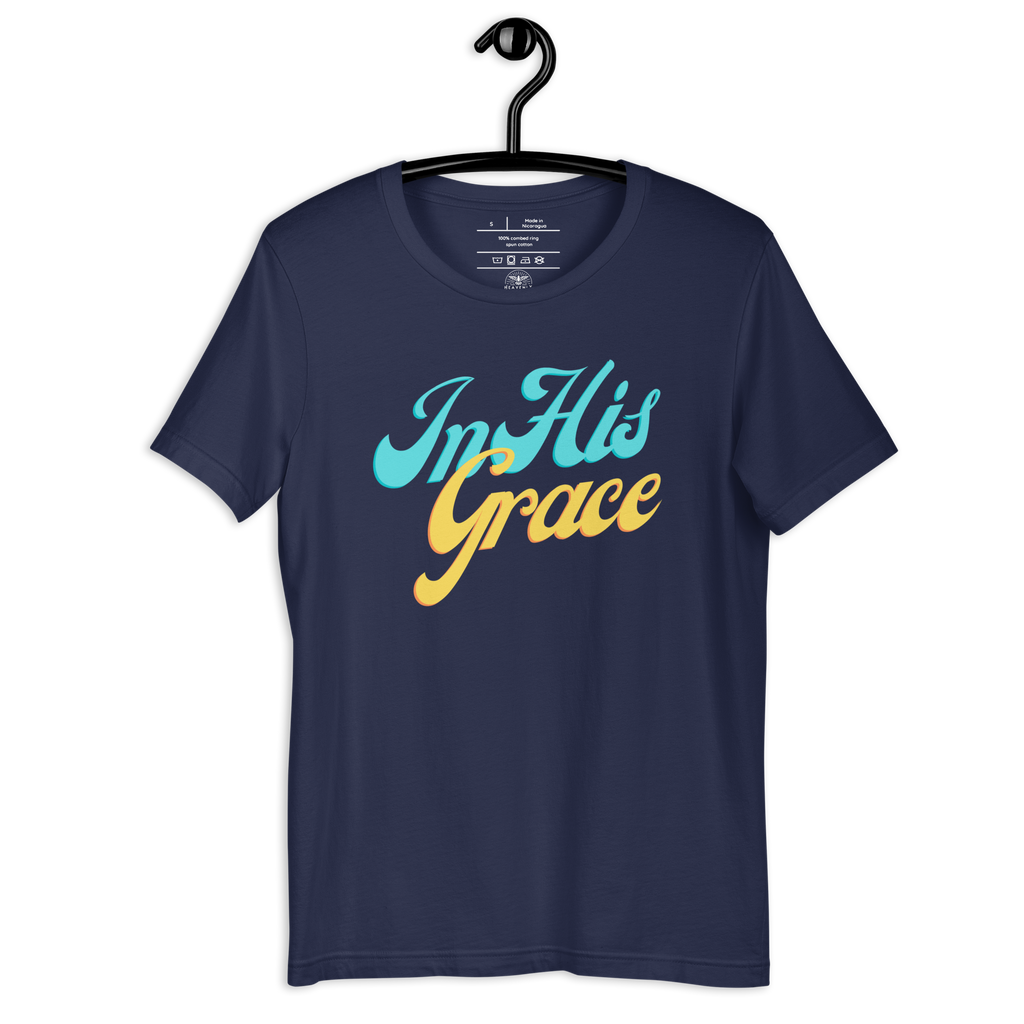 Navy 'In His Grace' T-shirt on a wooden hanger, showcasing the front script.