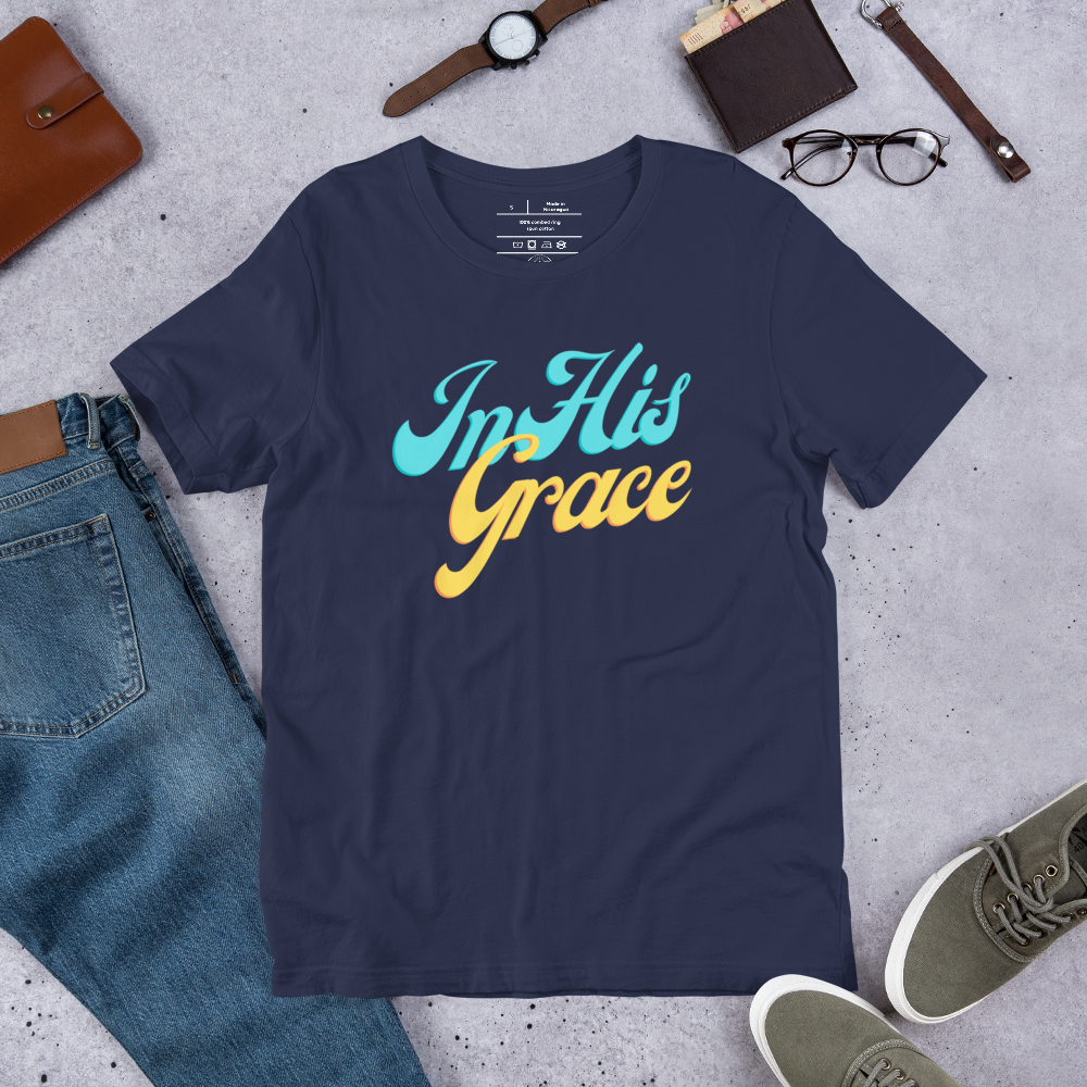 Shop display featuring the 'In His Grace' T-shirt in Navy with fancy script.