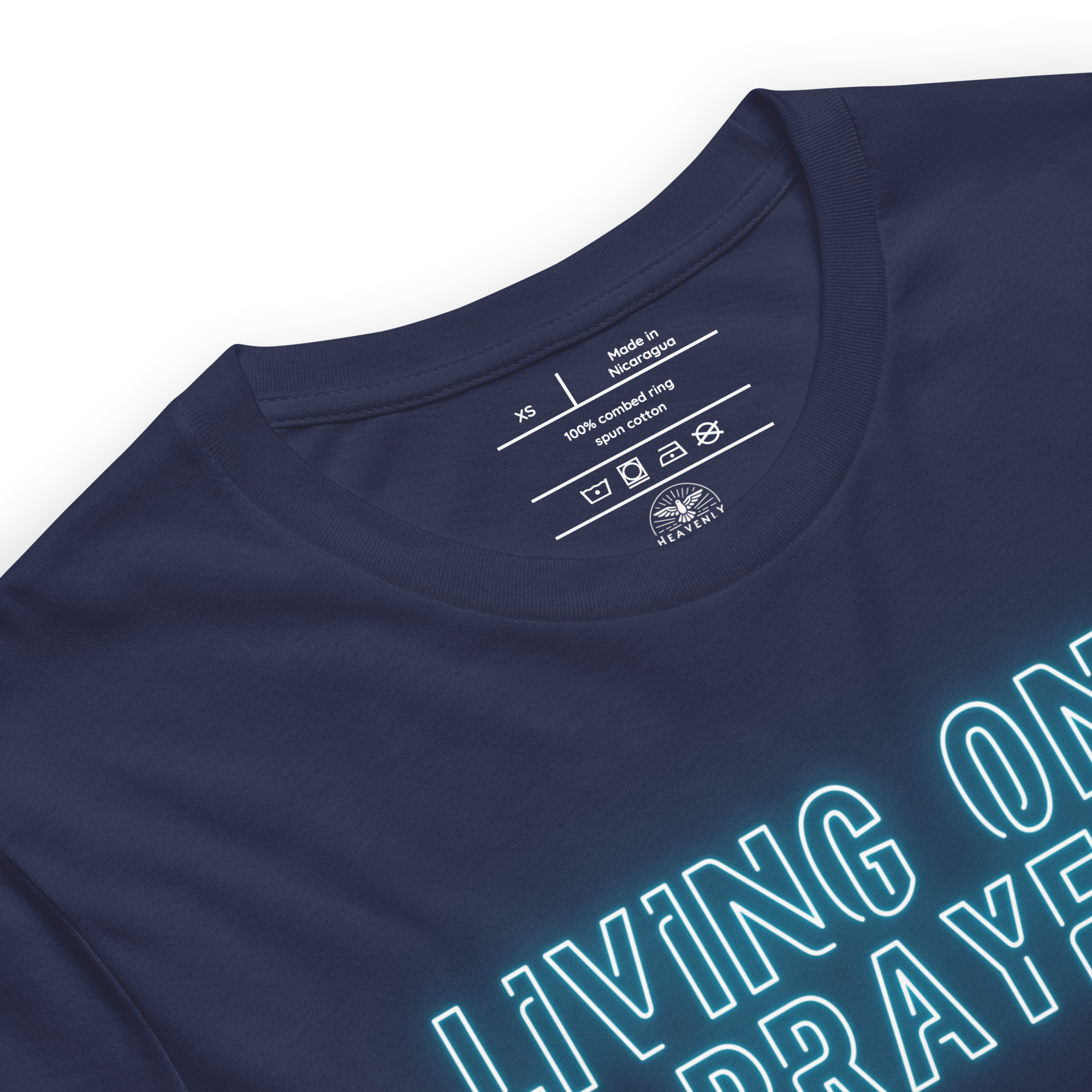 Close-up of neon 'Living on a Prayer' text on navy T-shirt, glowing effect.