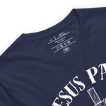 Inside label of 'Jesus Paid It All' T-shirt showing brand and care instructions.