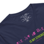 Logo stamp inside 'The Joy of the Lord is My Strength' T-shirt in navy, showing brand and care instructions.
