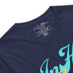 Inside label of 'In His Grace' T-shirt showing fabric and care instructions Heavenly Crafted Online Store 