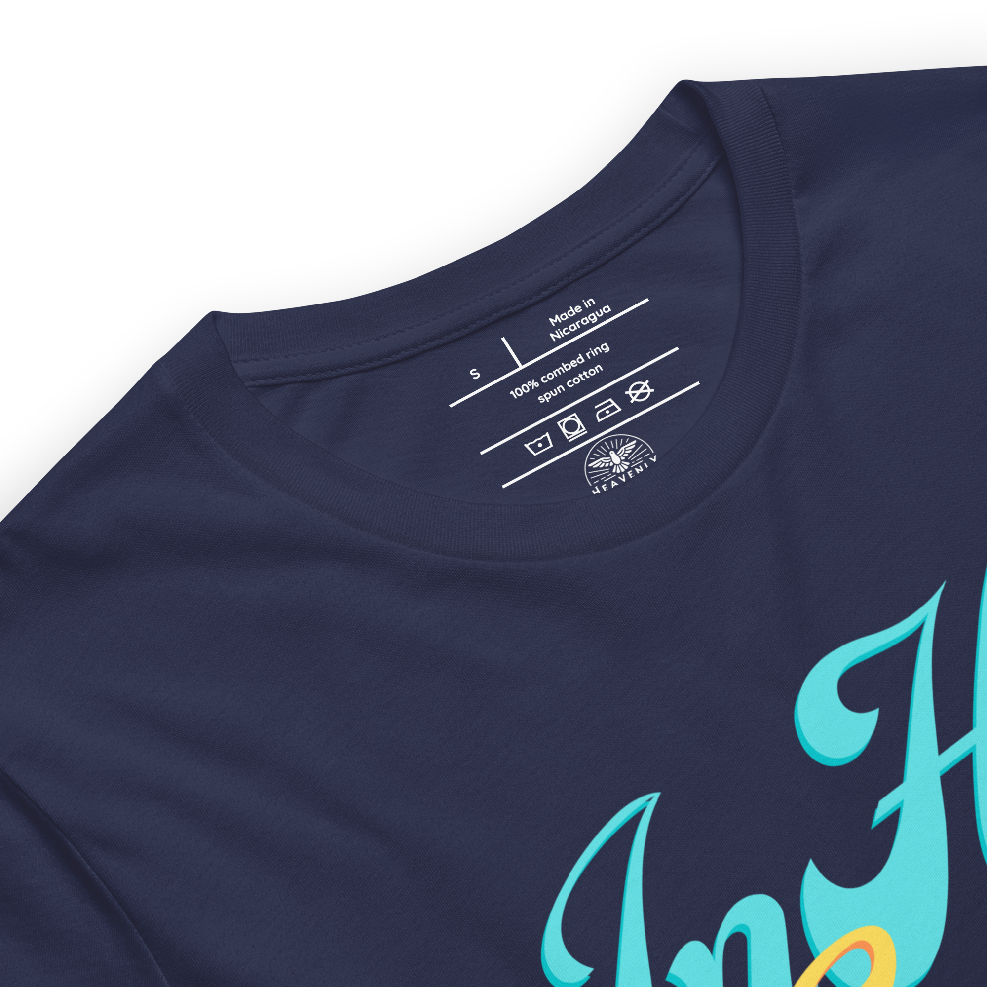 Inside label of 'In His Grace' T-shirt showing fabric and care instructions Heavenly Crafted Online Store 