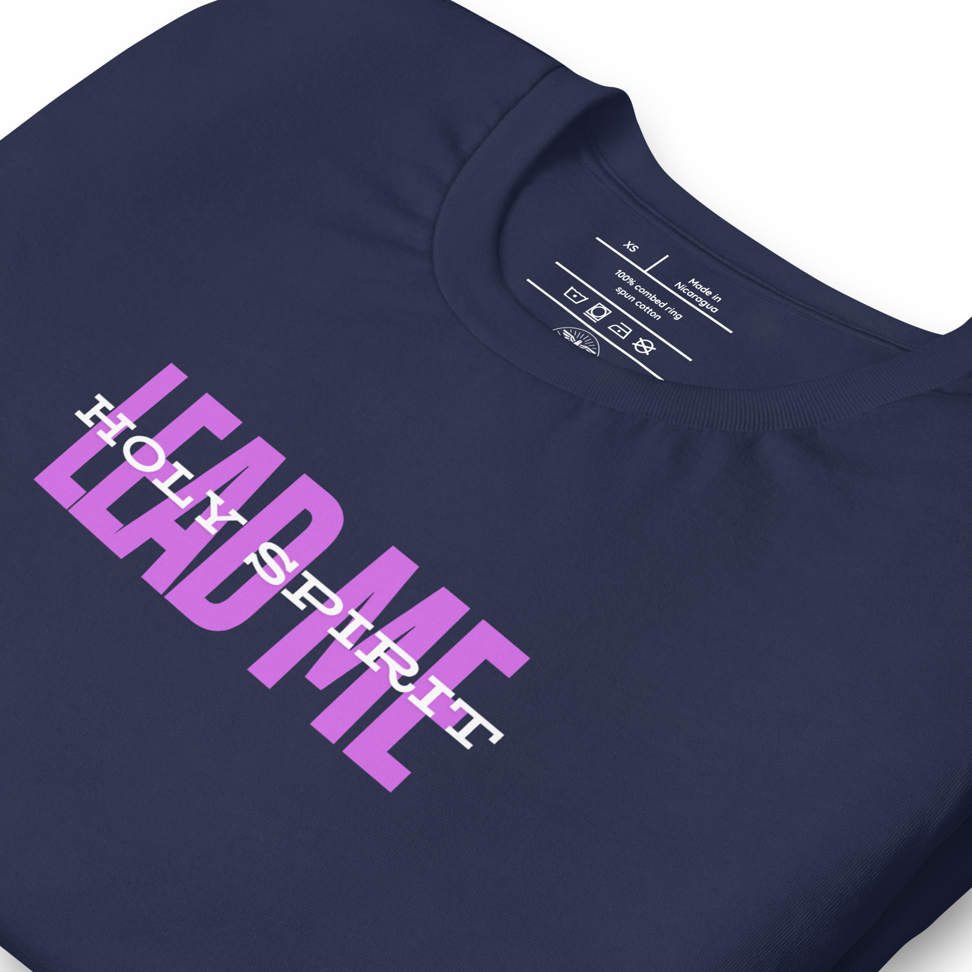 Close-up of 'Holy Spirit Lead Me' text on navy T-shirt.