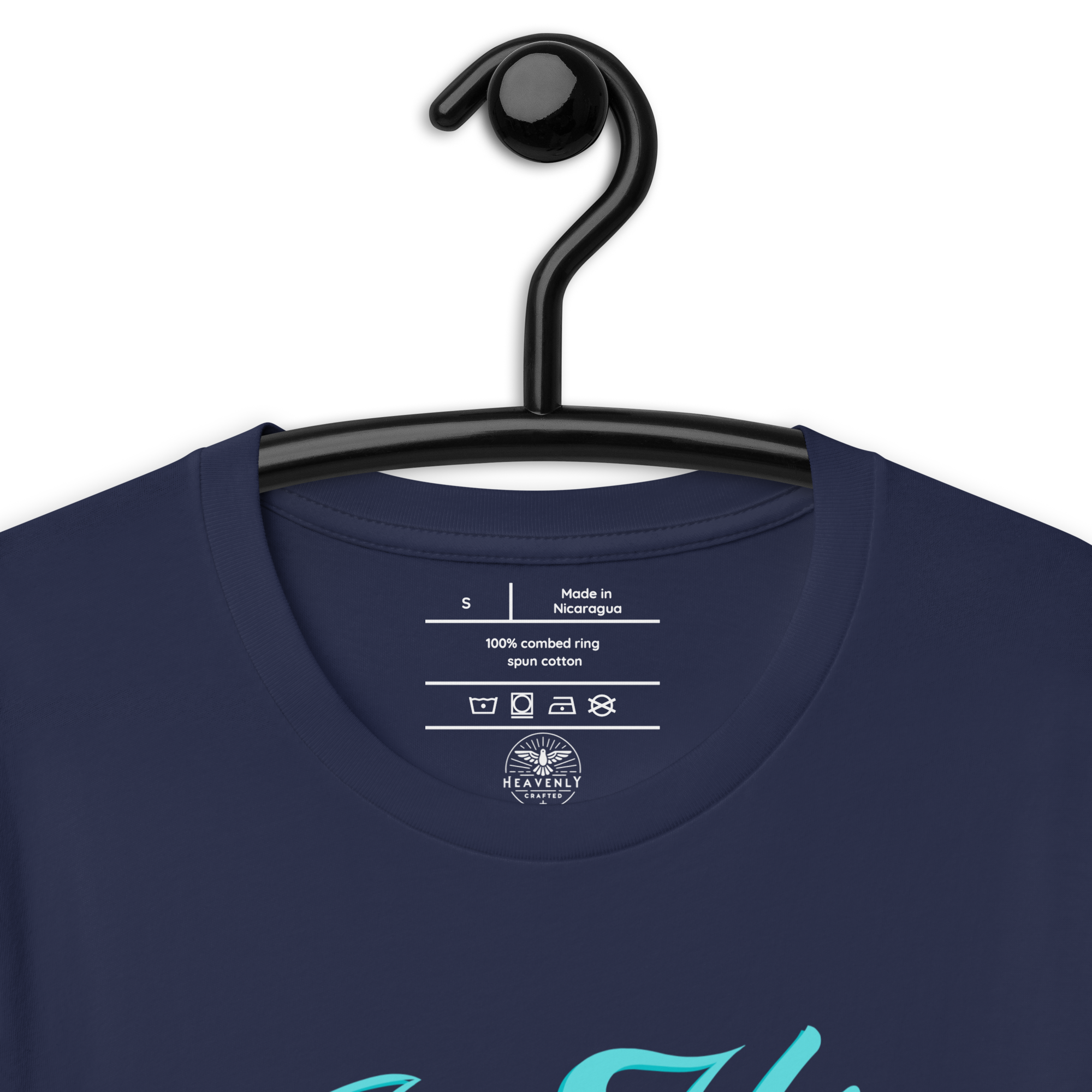 Navy 'In His Grace' T-shirt on a wooden hanger, showcasing the front script,  Inside label of 'In His Grace' T-shirt showing fabric and care instructions Heavenly Crafted Online Store