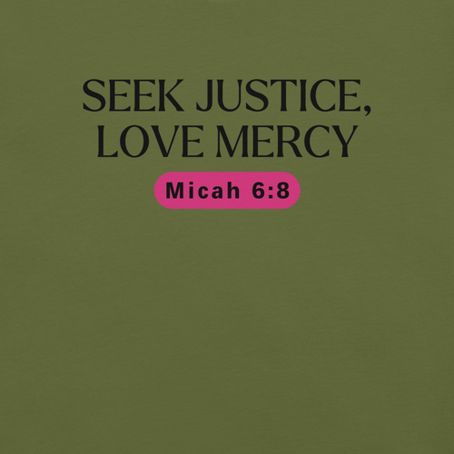 Close-up of the logo on the 'Army of Faith' T-shirt in Army Green, displaying the intricate black text and pink button-like design. Showcasing brand details and care instructions, this design draws inspiration from Ephesians 6:11, emphasizing the shirt's message of strength and protection.